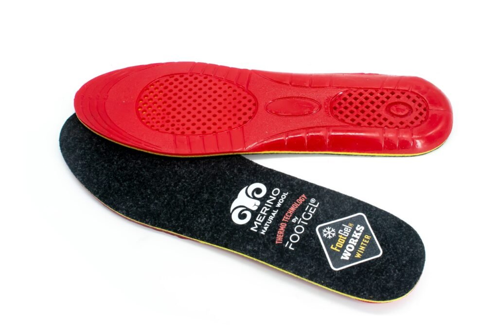 Footgel Works Winter red gel underside above the black merino wool surface