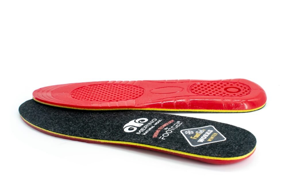 Footgel Works Winter angled view of the black merino wool surface and red gel underside